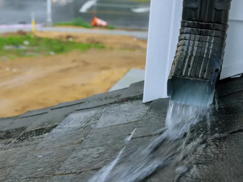 Rainwater flowing cleanly from downspout